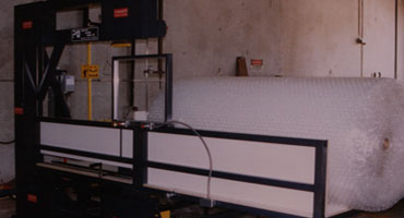 picture of a industrial band saw that can cut packaging material